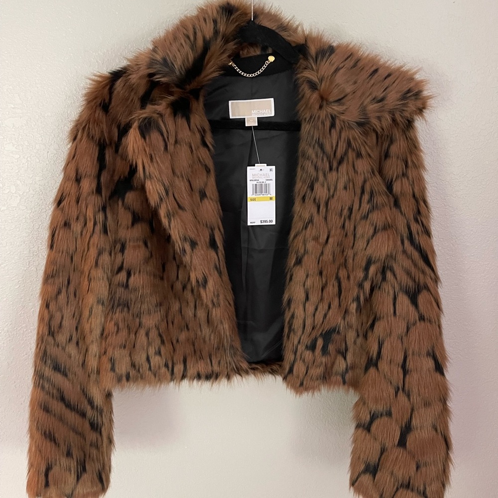 New with tags Michael Kors faux fur jacket. Size medium.